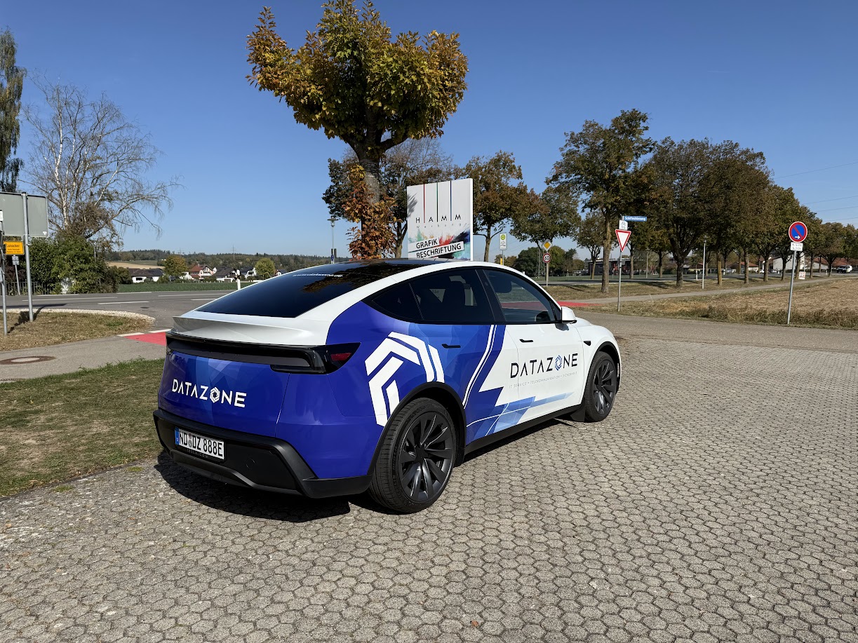 Tesla Model Y with DATAZONE livery, three-quarter view